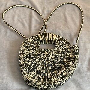 Urban Expressions straw Black and Cream Clutch with Elegant Design